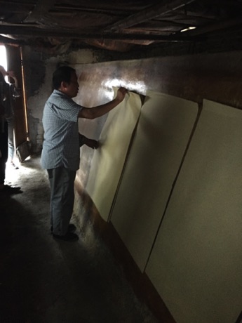 Paper Making: Drying the paper 
over a charcoal kiln: Tantau